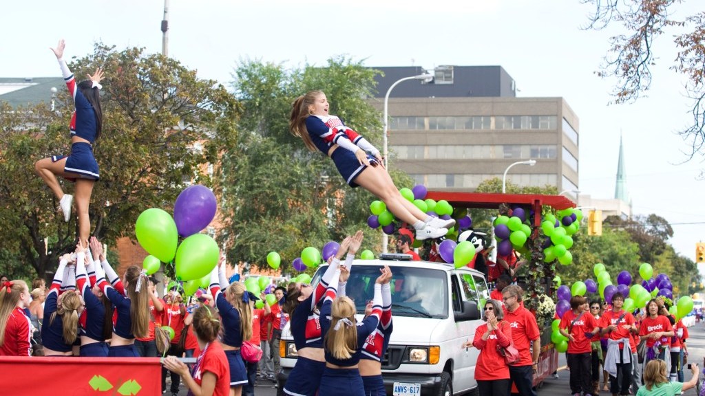 Brock Universit's float in the Niagara Wine Festival Grande Parade Brock University cheerleaders pump up the crowd at the Niagara Grape and Wine Festival’s SmartCentres Retrocom Grande Parade
